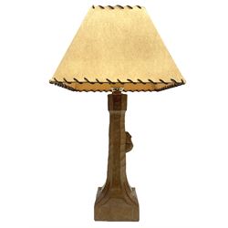 'Mouseman' tooled oak table lamp, the octagonal tapered stem carved with mouse signature, with shade, by Robert Thompson of Kilburn
