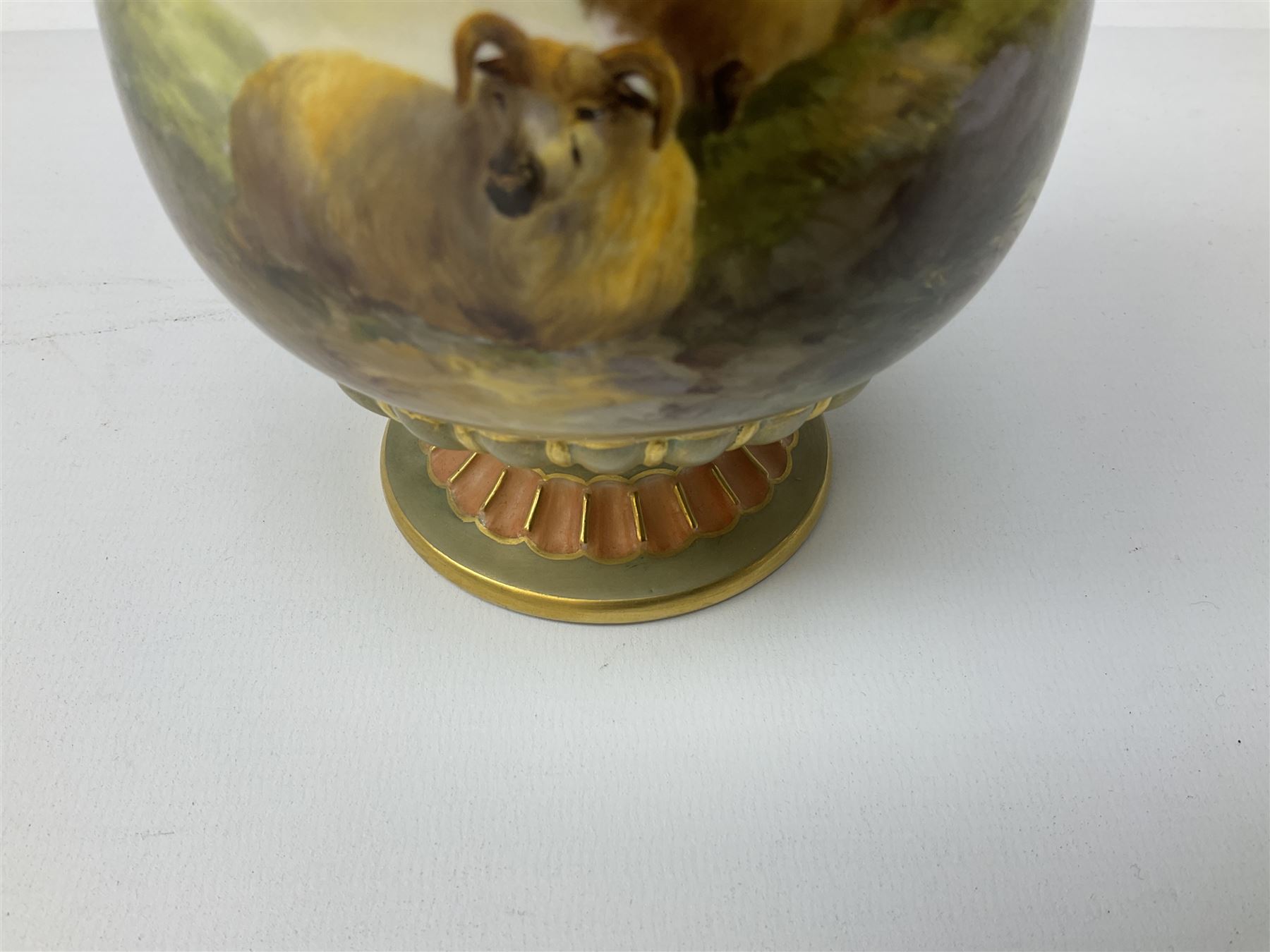 Early 20th century Royal Worcester vase decorated by Harry Davis, of ovoid form with twin acanthus mounted handles and waisted high neck supporting a domed cover, upon a circular foot, the body hand painted with sheep in a highland landscape, signed H Davis, with puce printed marks beneath including shape number 2425, and date code for 1907, H27.5cm