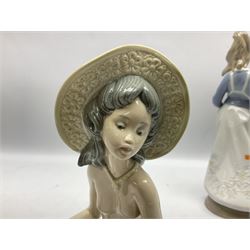 Three Lladro figures, comprising Modern Mother no 5873, Dropping the Flowers no 1285 and On the Beach no 1481, all with original boxes, largest example H30cm