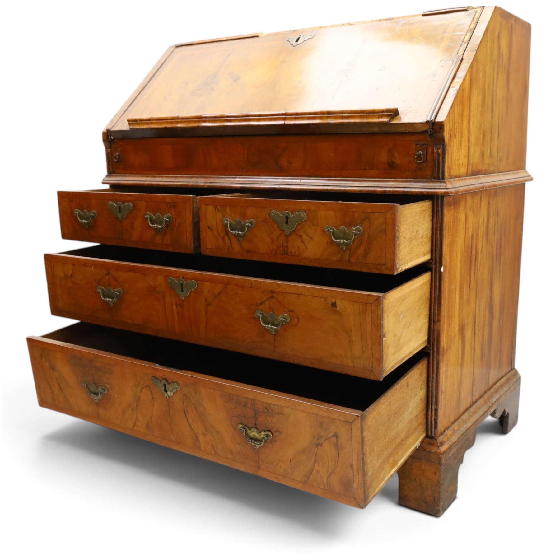 18th century figured walnut bureau, the sloped fall-front enclosing fitted interior with sliding base, pigeon-holes and correspondence drawers with shaped facias, over two short and two long feather-banded drawers with pressed brass handle plates, on bracket feet