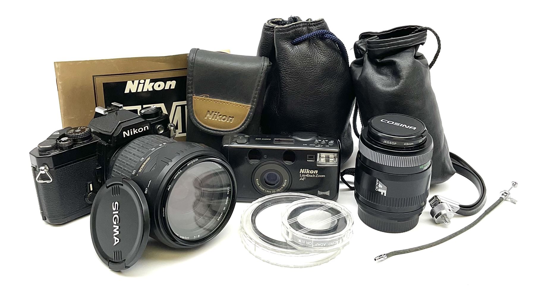 Nikon FM 35mm SLR camera body, Sigma 28-300mm 1:3.5-6.3 lens, Cosina 100mm 1:3.5 macro lens, two macro adaptors, instruction manual, Nikon 'Lite-Touch zoom' 35mm camera, and three relating carrying cases