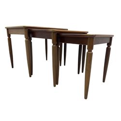 G-Plan - teak nest of three tables, rectangular top raised on turned supports