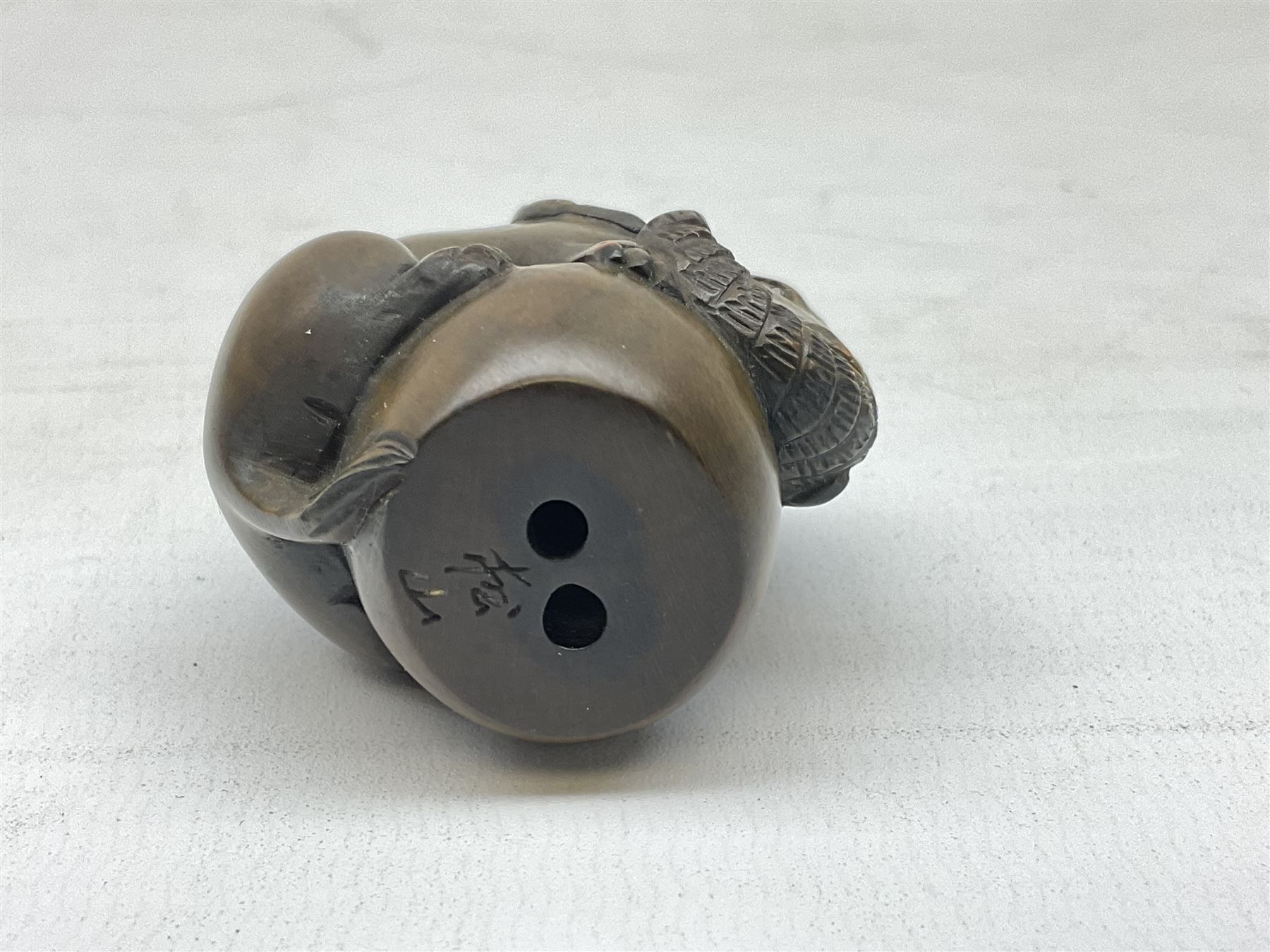 Netsuke in the form of an elephant, signed to base