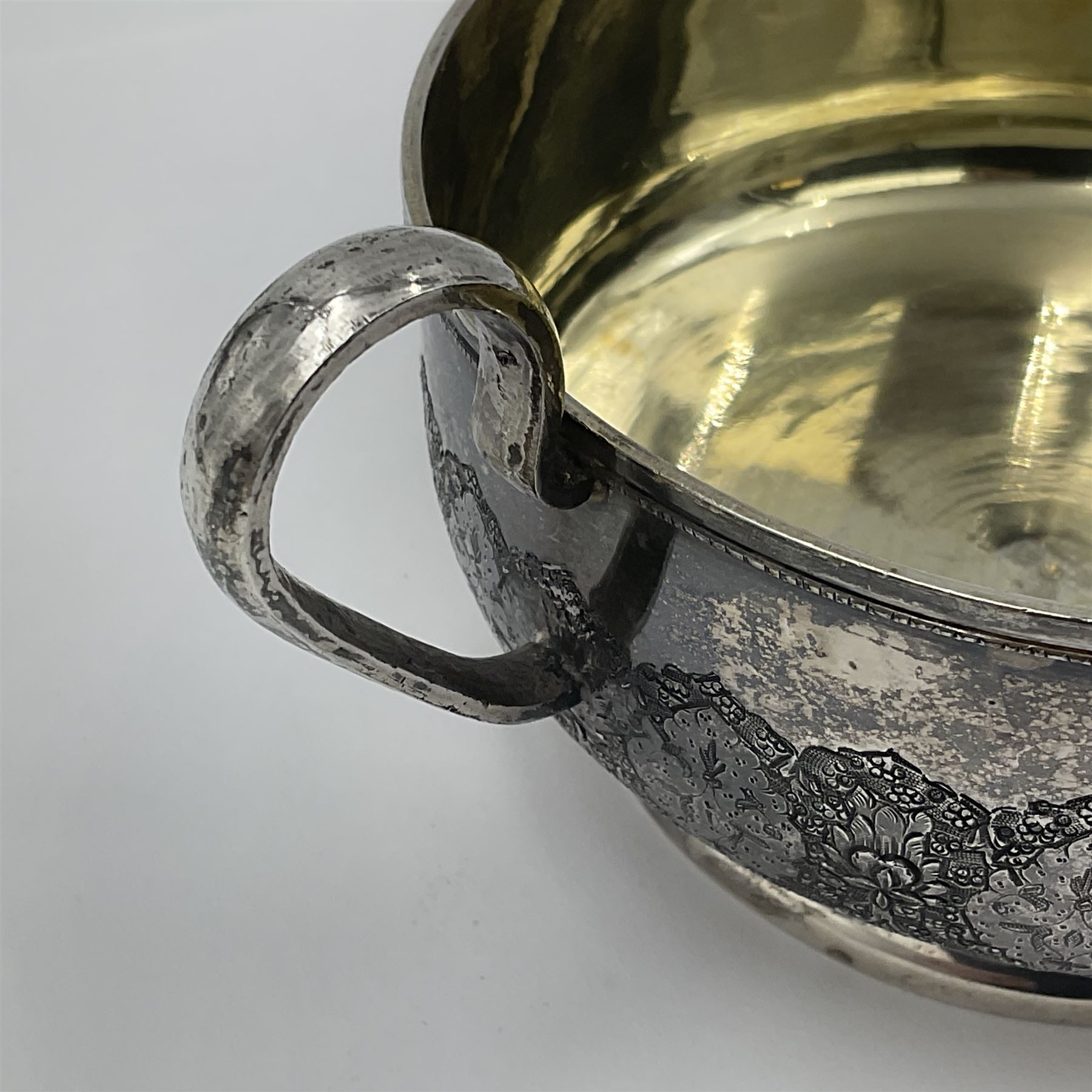 Early/mid 20th century Persian silver tea service, comprising circular serving tray, teapot, twin handled sucrier and cover, milk jug, five tea glasses with six silver holders, six tea spoons, and pair of sugar tongs, each profusely chased with foliate arabesque decoration, each bearing marks including 84 for 840 fineness, tray D40cm, teapot H16cm