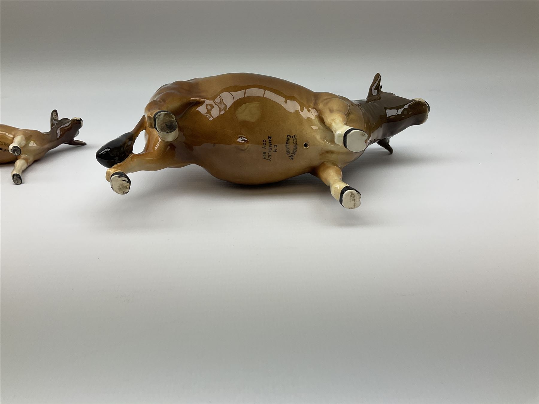 Beswick Jersey family group, comprising bull Dunsley Coy Boy model no 1422, cow Newton Tinkle model no 1345, and calf model no 1249d.