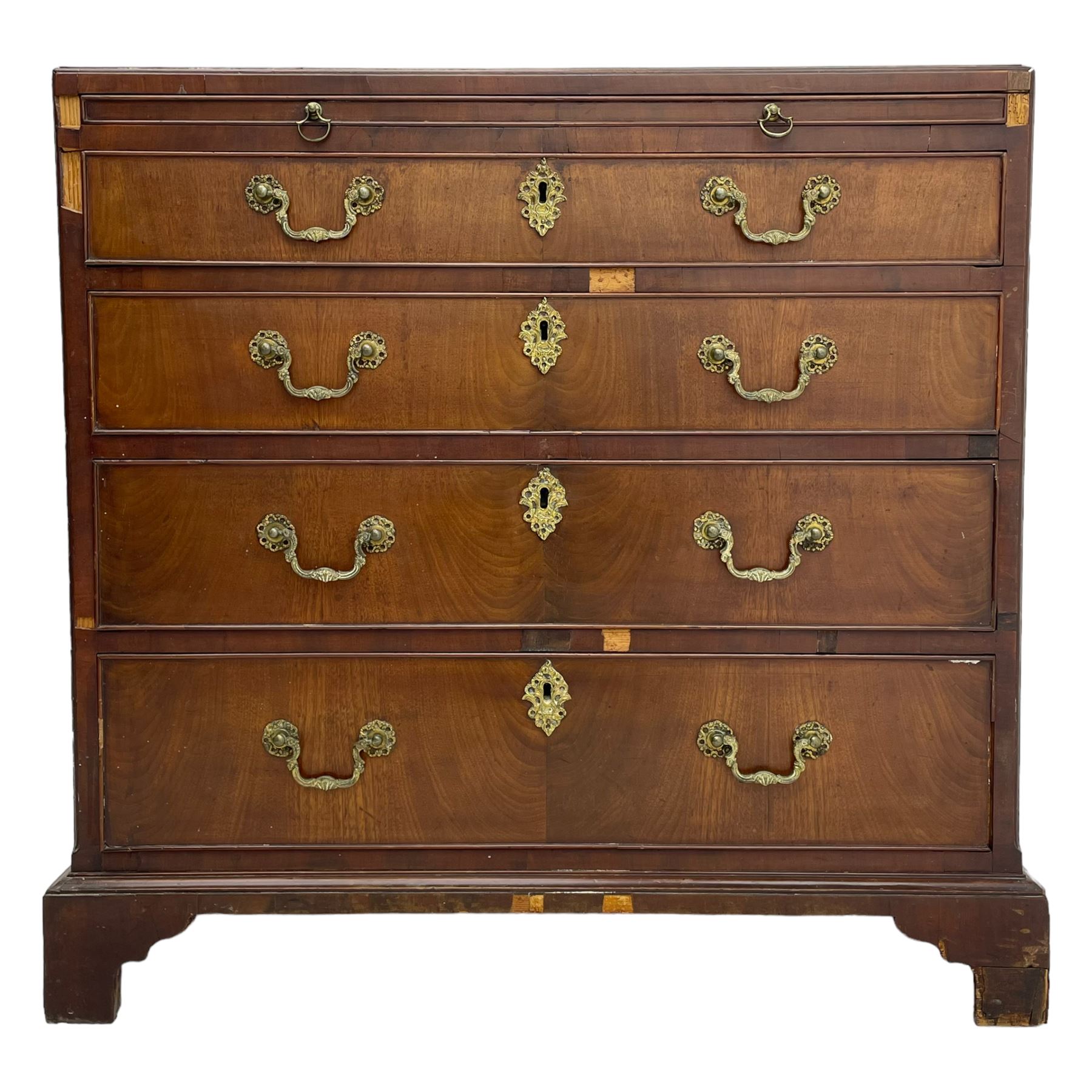 George III mahogany chest, banded caddy top with moulded edge, brushing slide over four graduating cock-beaded drawers, ornate cast gilt metal handle plates and escutcheons, swan neck handles cast with dolphins, shells and C-scrolls, lower moulding over bracket feet