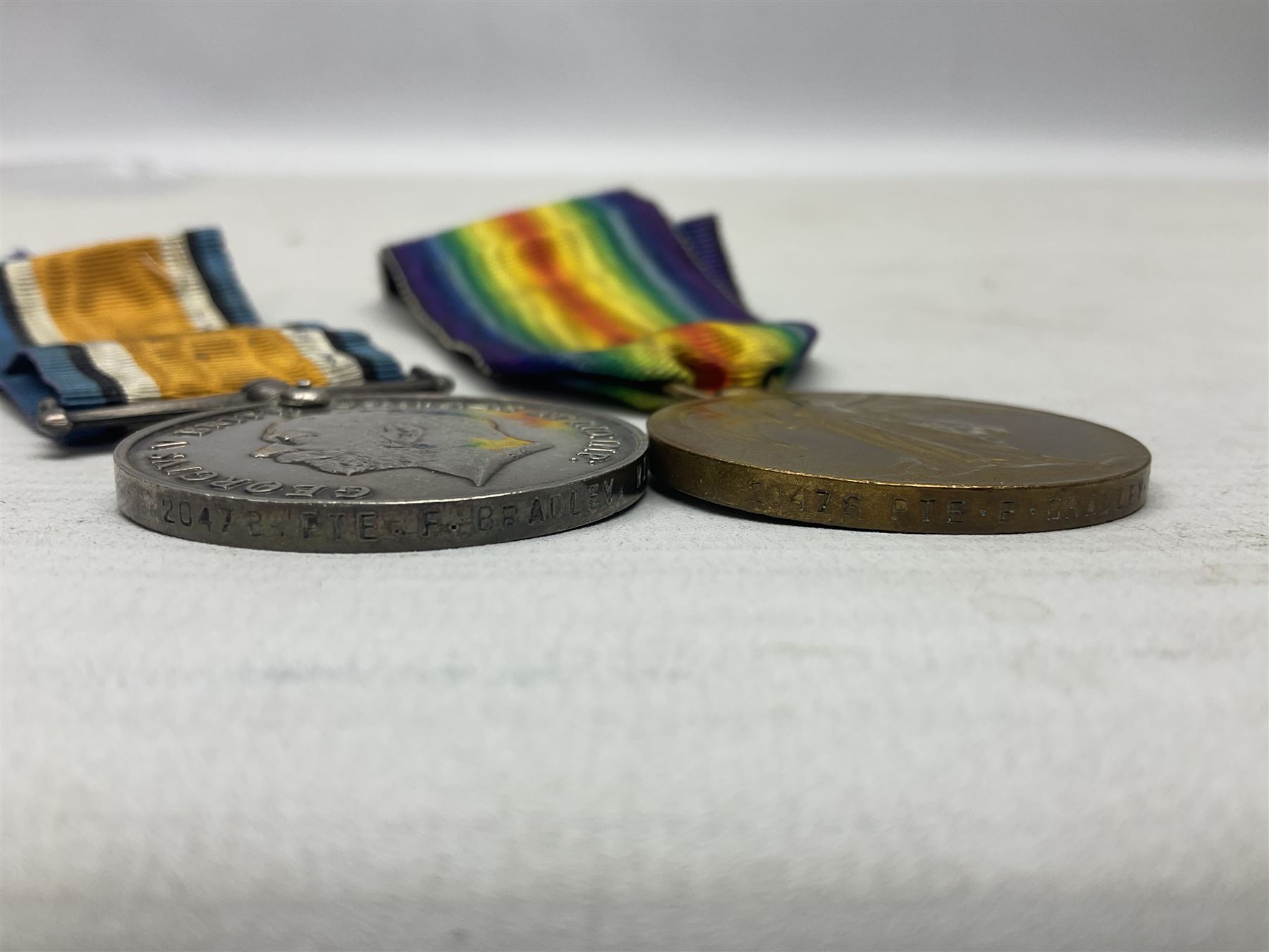 WW1 group of three medals comprising British War Medal, 1914-15 Star and Victory Medal awarded to 20478 Pte. F. Bradley Wilts. R.; all with ribbons; some biographical details