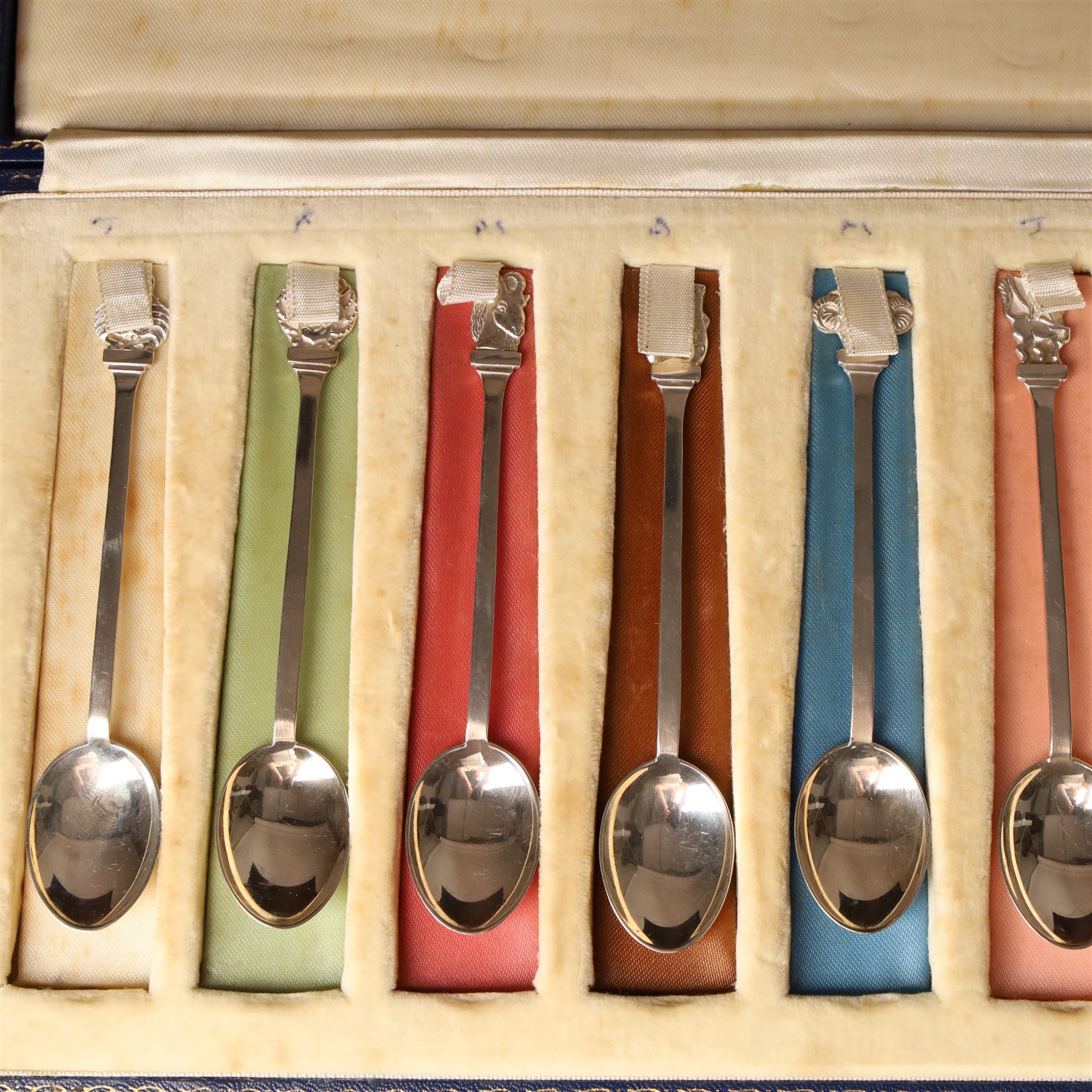 Cased set of silver Signs of the Zodiac spoons each with a different terminal L11cm London 1964 Maker Joseph Gloster Ltd