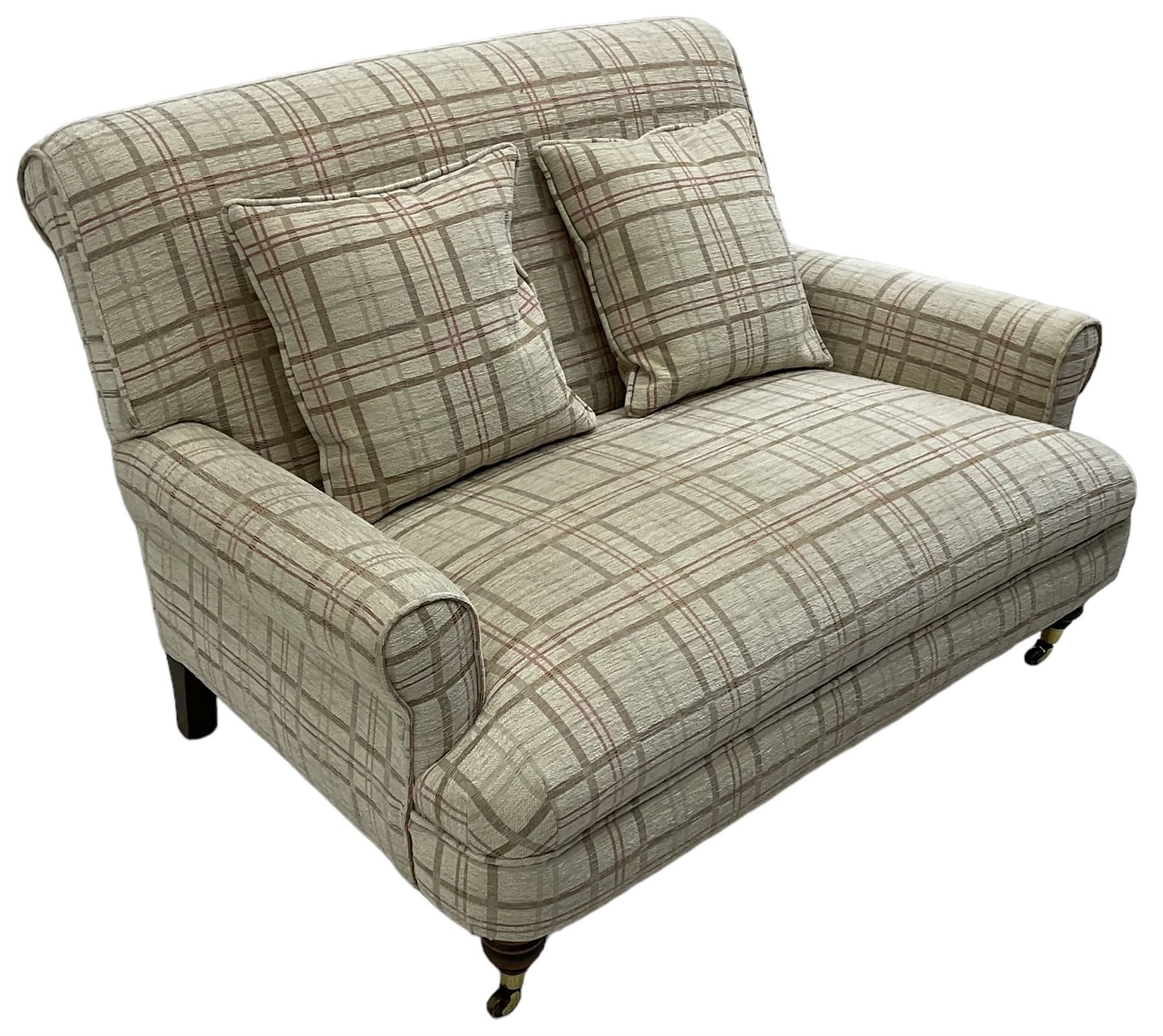 Traditionally shaped two-seat sofa, rolled back and arms, upholstered in checkered fabric, on turned front supports with brass cups and castors 