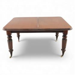 Large Victorian mahogany dining table, rectangular telescopic top with two additional leaves, upon turned knopped and reeded legs with ceramic casters, (Extends to 230cm)