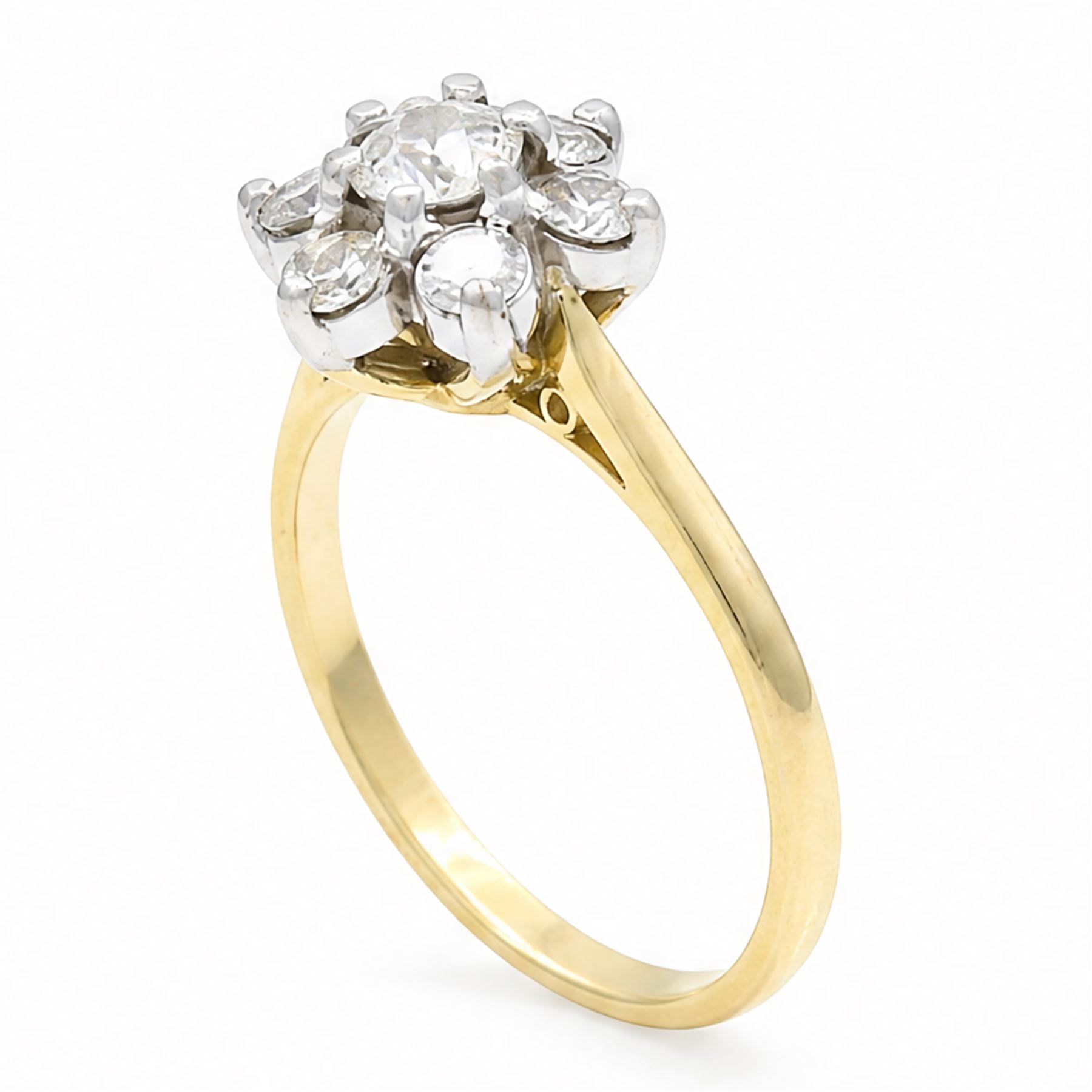 18ct gold diamond flower head cluster ring, principal round cut diamond of approx 0.55 carat, surrounded by six round brilliant cut diamonds, hallmarked, total diamond weight 1.15 carat