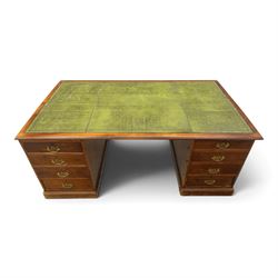 Edwardian mahogany office desk, recatangular top with green inset leather writing surface, fitted with two banks of four drawers, brass swan neck handles with ornate backplates
