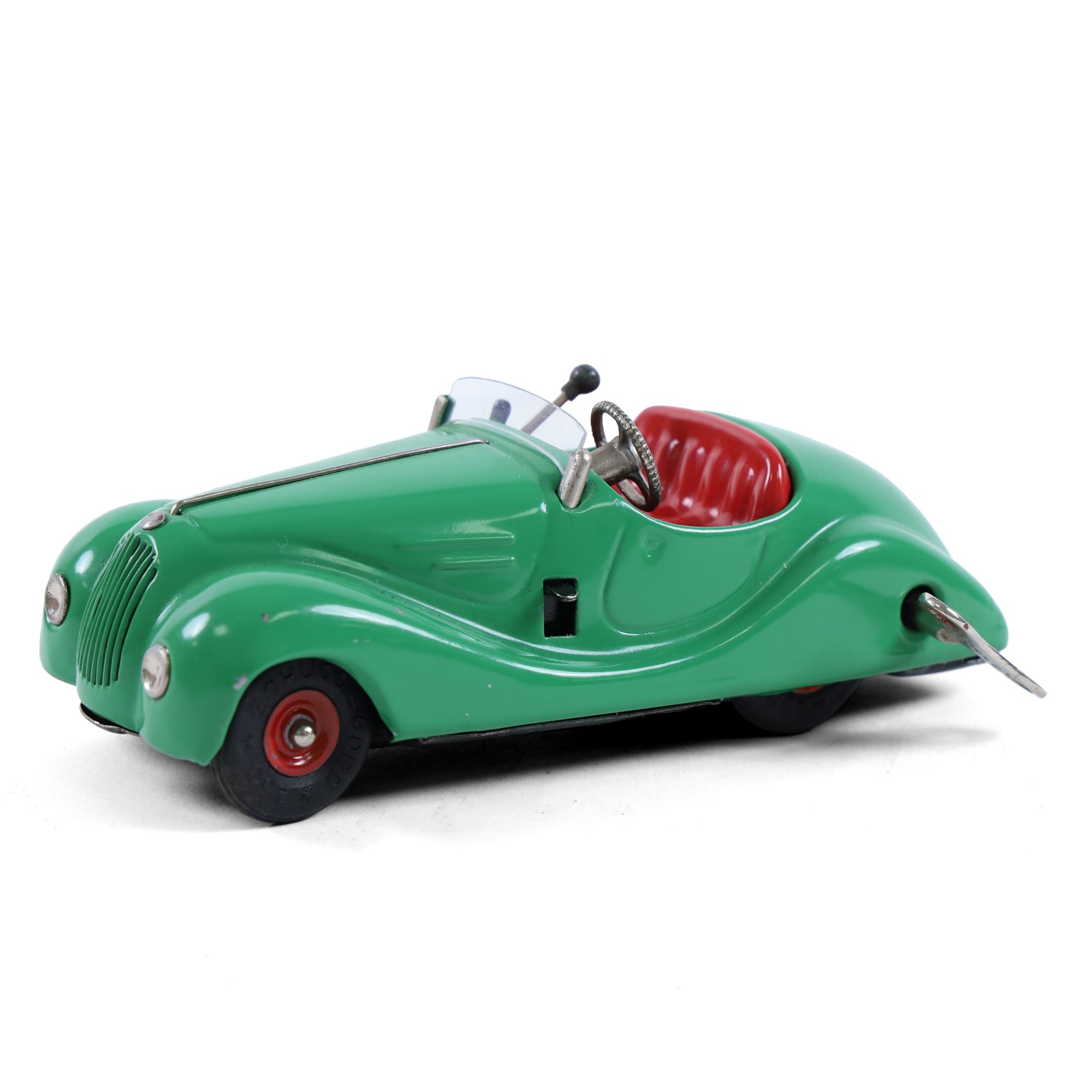 Schuco Examico 4001 tinplate clockwork car, in green with red interior, with key