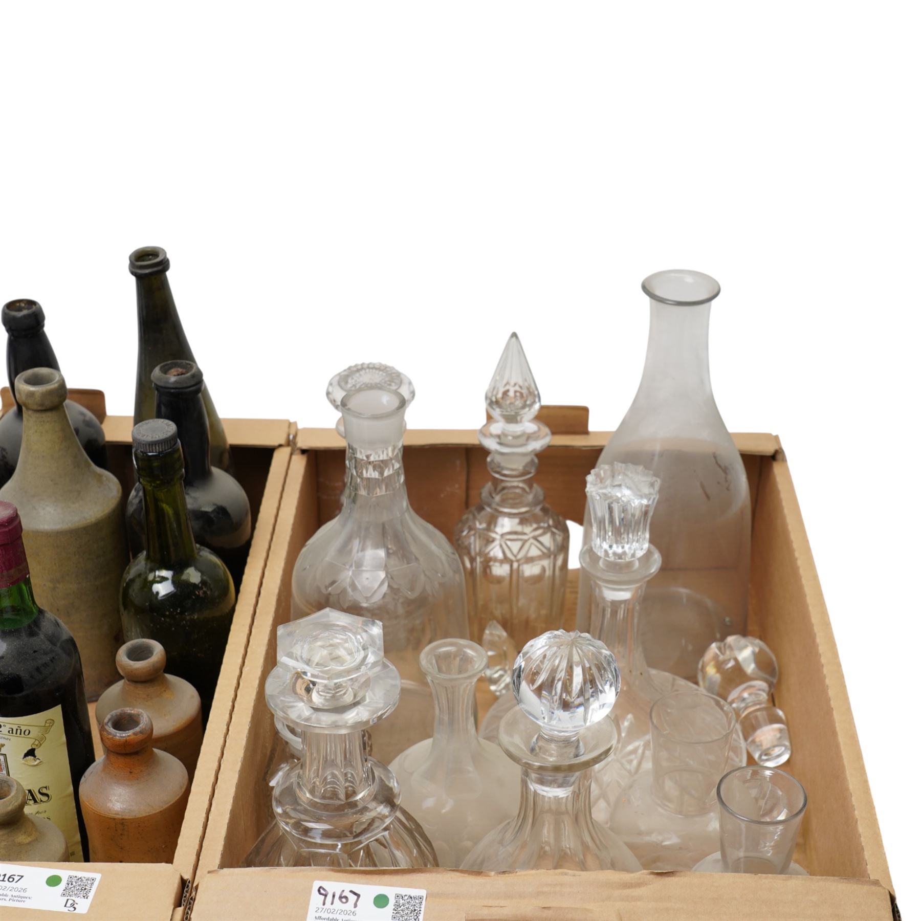 Glass dome shade, various glass decanters and coloured glass bottles