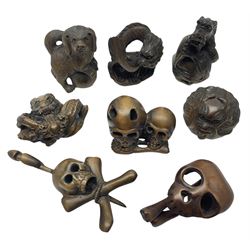 Eight netsuke, modelled as skulls, dragons and mythical beasts 
