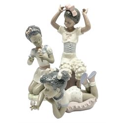 Three Lladro figures, comprising Rhumba, no 5160, year issued 1982, Sing With Me no 5837 and Sharing Sweets no 5836, all with original boxes, largest example H24cm