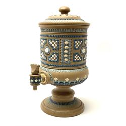 A late 19th century Doulton Lambeth stoneware water filter with original spigot, decorated with relief moulded foliate bands, with impressed marks and monogrammed for Laura Gooderham beneath, H34cm. 