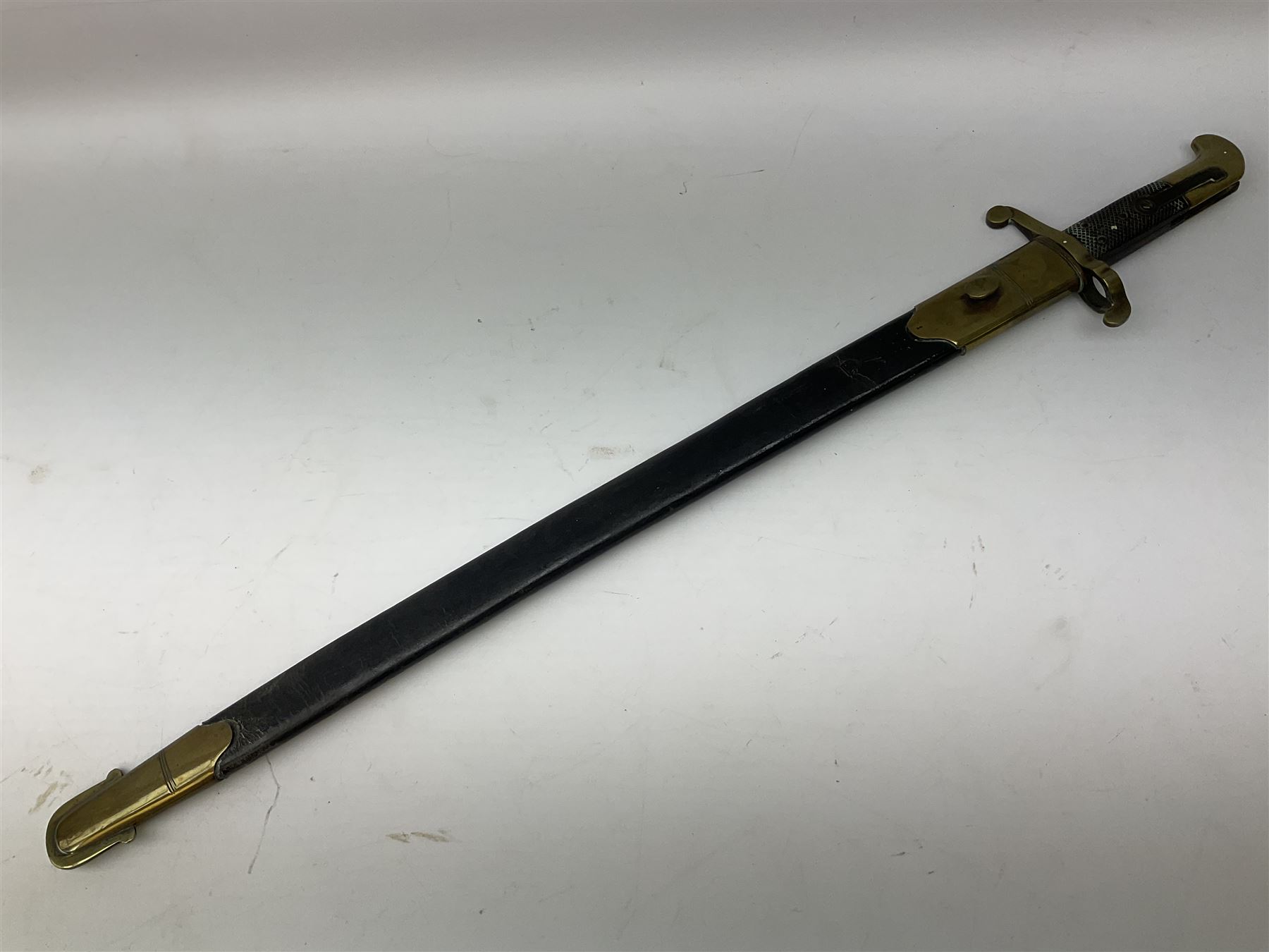 British 1855 pattern 'Sappers & Miners' Lancaster sword bayonet as issued to Medical Corps, the 62cm steel blade marked S&K with various numbers; in brass mounted leather scabbard numbered 1176