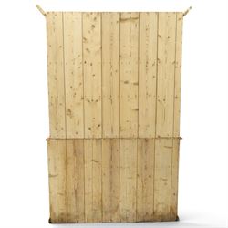 Victorian stripped pine and glazed dresser, projecting ovolo cornice over glazed doors enclosing two shelves, the base fitted with two drawers over panelled cupboards with ceramic handles, on moulded skirted base