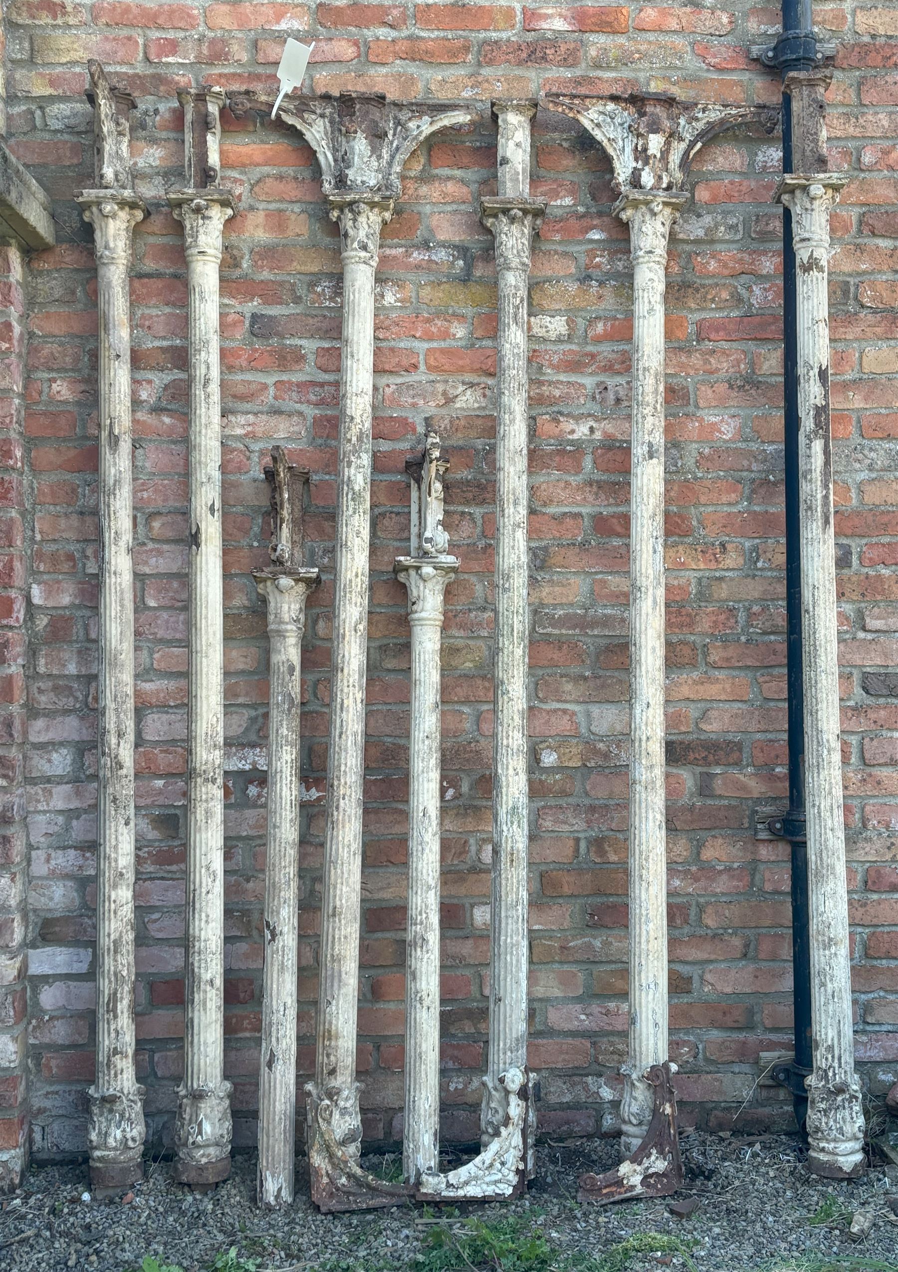 Set of eight Victorian cast iron reclaimed architectural columns, removed from a small gauge railway station, each highly detailed with acanthus cast capitals above fluted columns, six having further acanthus to base. H242cm / 160cm.  - COLLECTION BY APPOINTMENT FROM: The White House, Thirsk Road, Easingwold, York, YO61 3NF - CALL 01723 507111 TO ARRANGE