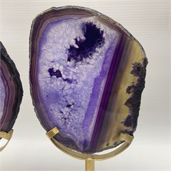 Pair of purple agate slices, polished with rough edges raised upon gilt metal stands