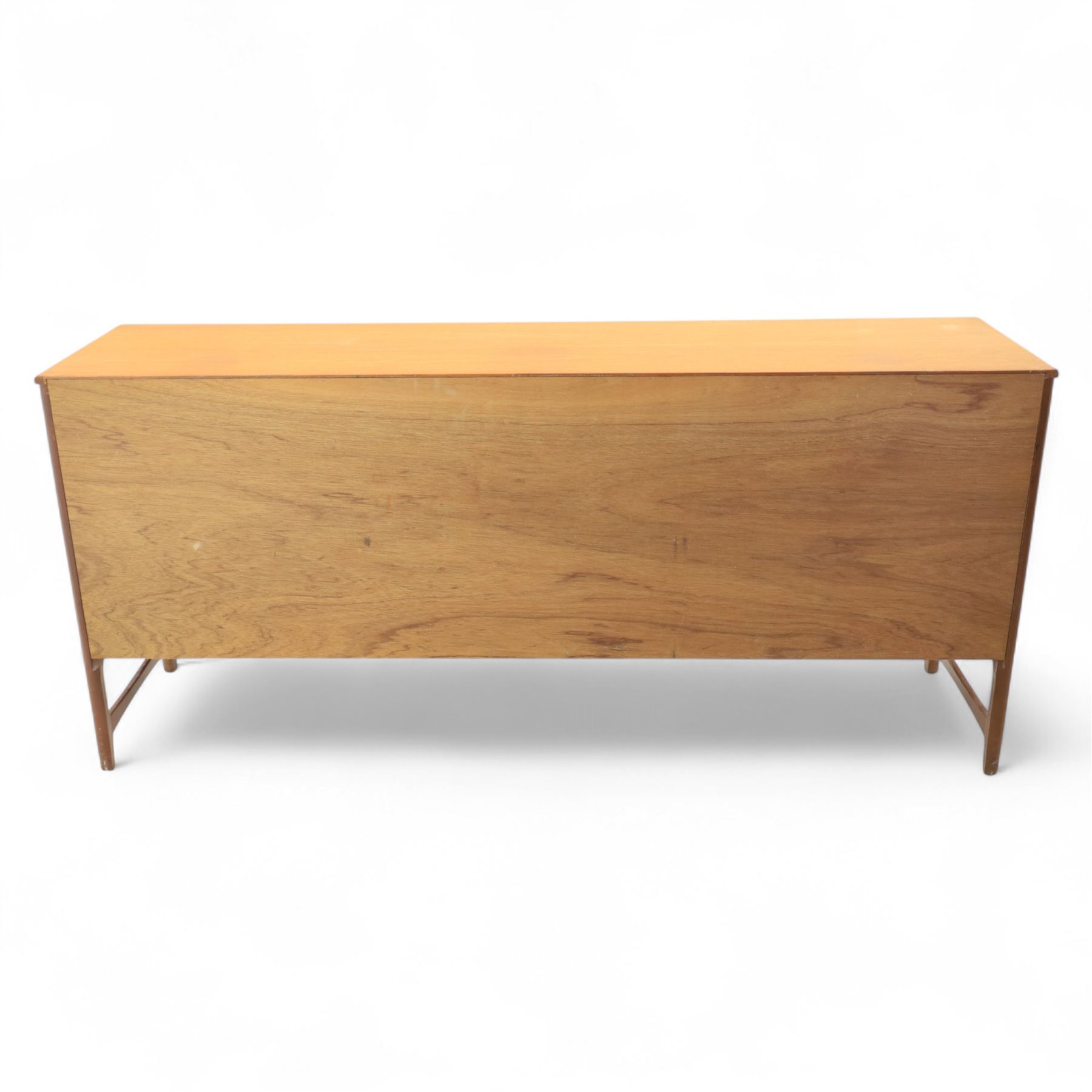 Nathan - mid 20th century teak sideboard, fitted with three drawers with brass ring handles, above a central fall front cabinet, flanked by two cupboard doors, raised on square tapering supports