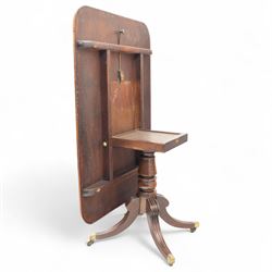 George IV mahogany breakfast table, rectangular tilt-top with reeded edge, rounded corners, supported on a turned column and raised on a quadripartite base with reeded down-swept legs terminating in brass cap castors