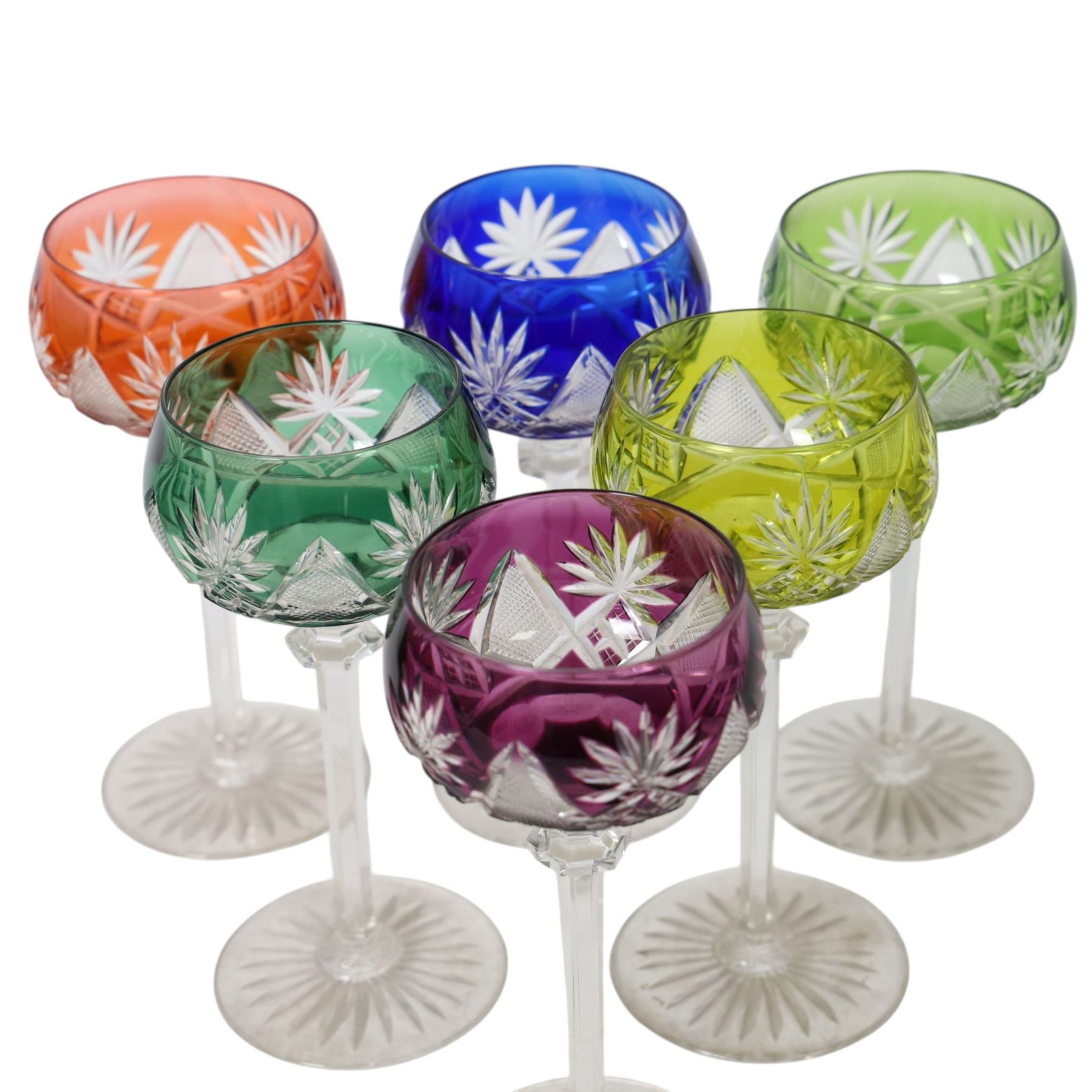 Set of six 20th Century Val St Lambert Berncastel style crystal glass wine glasses, in yellow, greens, red, purple and blue, flash cut with a repeat diamond and plume pattern above a knopped cut stem and circular spread foot, H18cm
