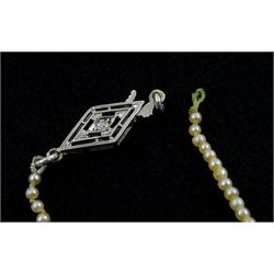 Three strand pearl necklace, with platinum diamond milgrain clasp and a single strand graduating pearl necklace with 18ct white gold clasp set with a diamond
