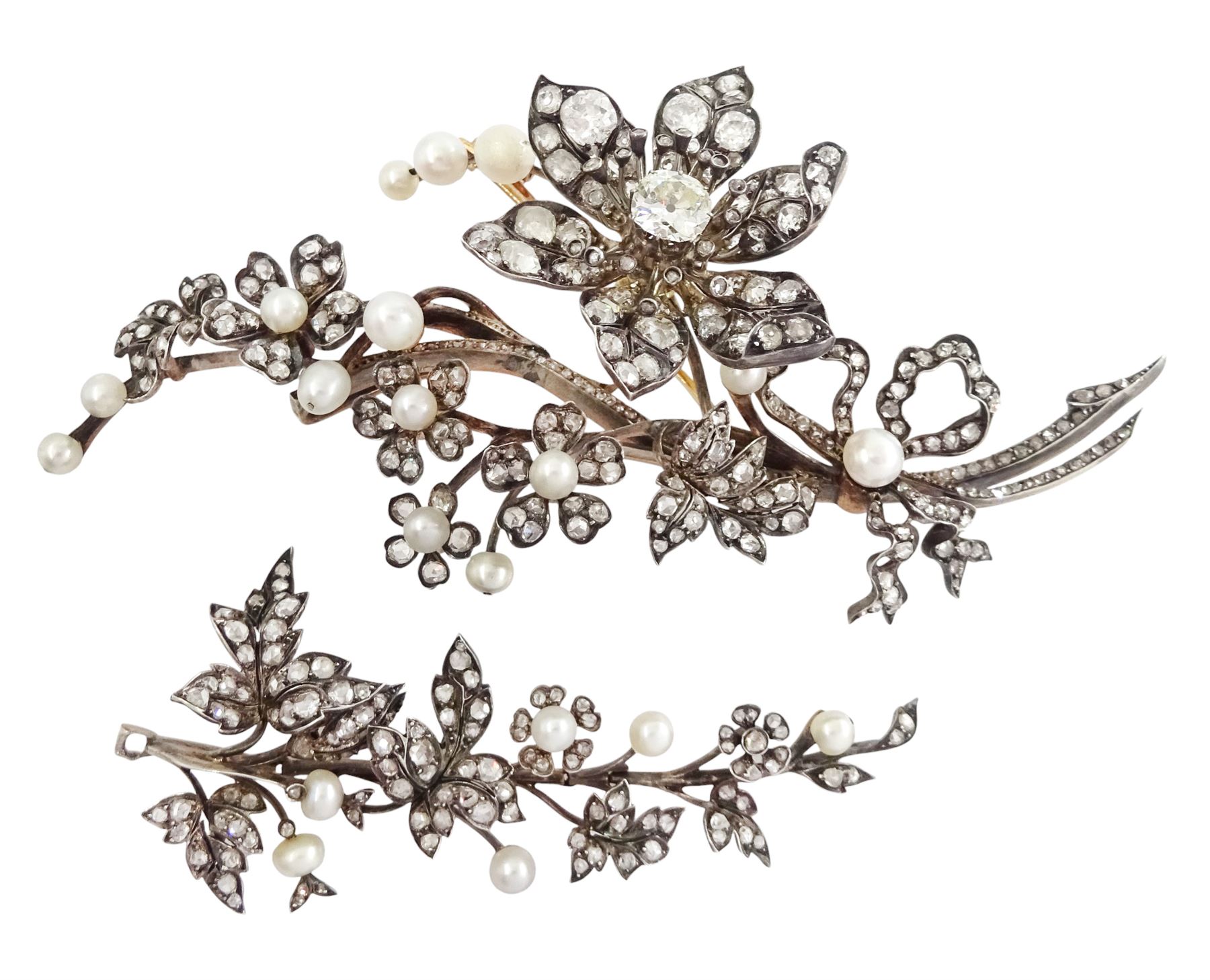 19th century gold and silver diamond and pearl en tremblant detachable brooch, the flower tremblant with a principal old cut diamond of approx 1.90 carat, the petals and stamen set with old cut and rose cut diamonds, total diamond weight approx 9.10 carat, to a foliate spray set set with further rose cut diamond and white / pink / cream pearls and ribbon tie