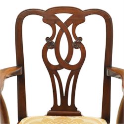 Late 19th century Chippendale style mahogany desk chair, with pierced splat and shaped and scrolled arms, raised on front claw and ball supports