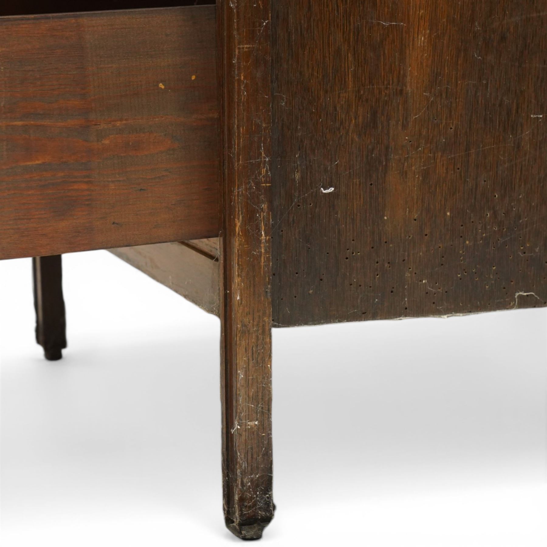 Edwardian tall oak chest fitted with six long drawers, on stile supports