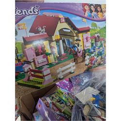 Lego Friends no. 3189 Stables set, Lego Trolls no. 41252 World Tour set, The Lego Movie set no. 70825, three small Lego Friends sets, all boxed and a quantity of loose Lego, including purple and pink colourways