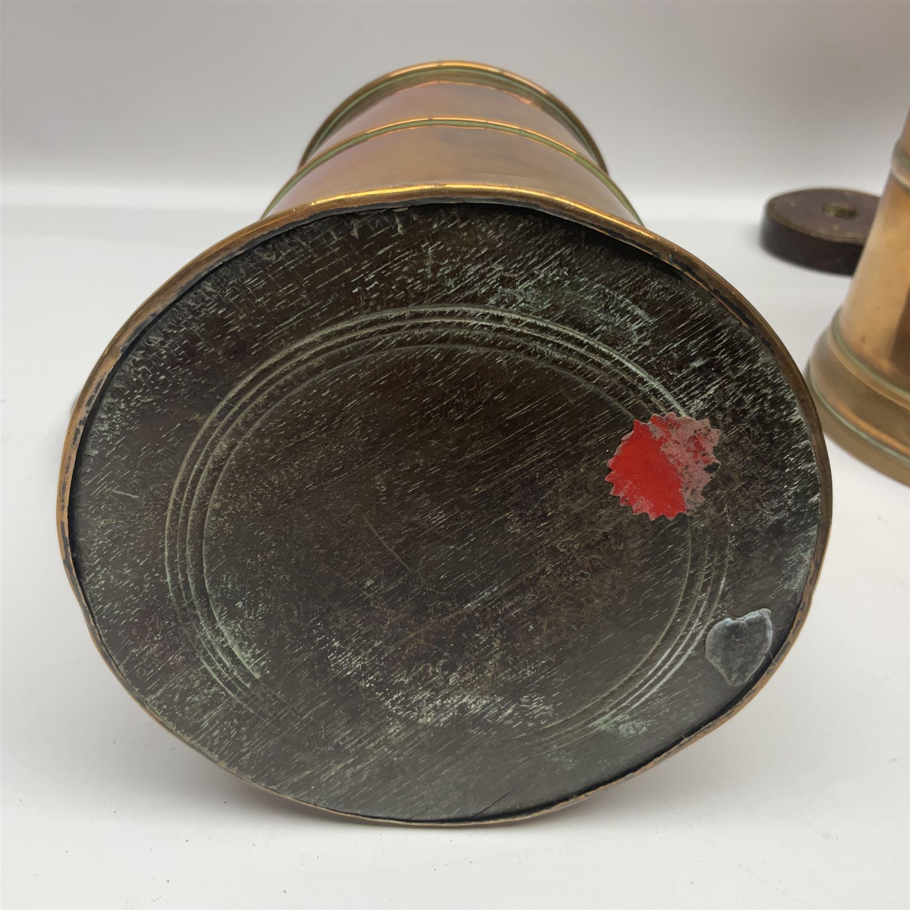 Two 19th century copper tankards, one with weighted wooden base, together with copper and wooden mechanical bellows, sundial and other metalware 