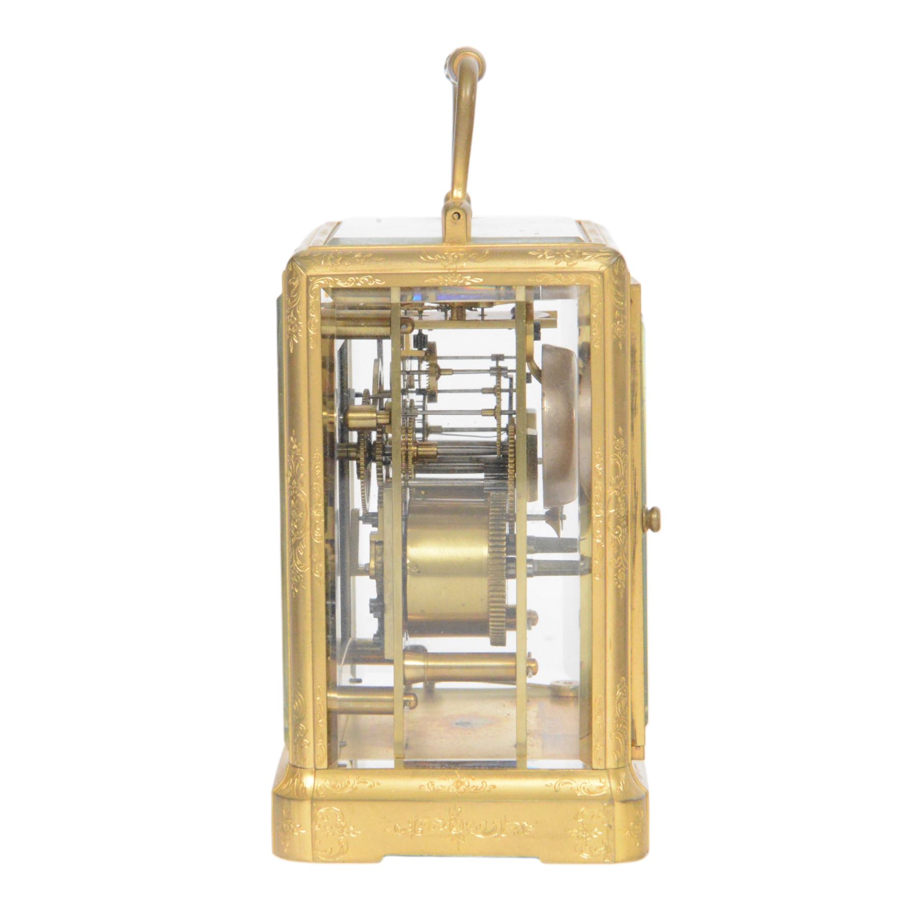 Late 19th century French 8-day brass cased carriage clock, Henry Marc of Paris, the gorge case with swing handle and four bevelled glass panels, white enamelled dial with Roman numerals and minute markers and steel hands, the two train movement with platform lever escapement, hour striking on a bell, with key