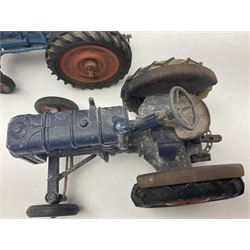 Chad Valley - two unboxed and playworn large scale Fordson tractors - No.9235 Fordson Major Tractor, dark blue diecast body, orange wheels, crank handle clockwork mechanism and 'Firestone' rubber tyres; and No.M59 New Fordson Major Tractor, blue diecast body, tinplate hinged bonnet, orange wheels and clockwork motor contained in rear wheel hub (2)