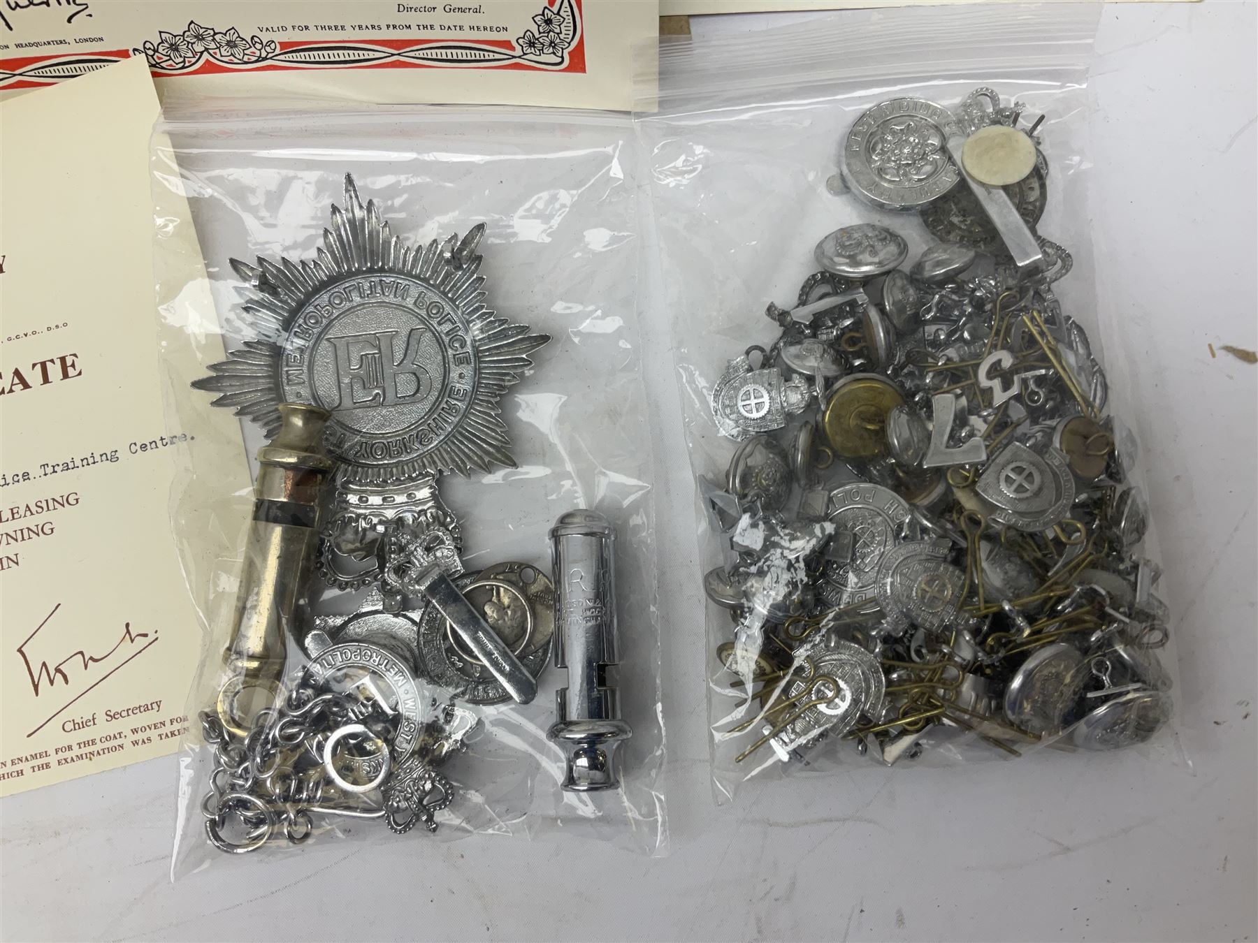 Archive of memorabilia and ephemera relating to Pc. (later Sgt.) Geoffrey Robinson of Dewsbury (later West Yorkshire) police force including cased Long Service and Good Conduct Medal; helmet plates and cap badges, collar numbers and uniform buttons, whistles, certificates, photographs, plaque etc 1960s - 1990s