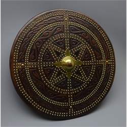  Replica Scottish Highlander's Targe by Joe Lindsay, based on an original targe which was 'Captured' at the battle of Culloden in 1746, the wooden shield covered in tooled leather with traditional Celtic designs, brass studs and mounts with deer skin hide verso, D49cm   