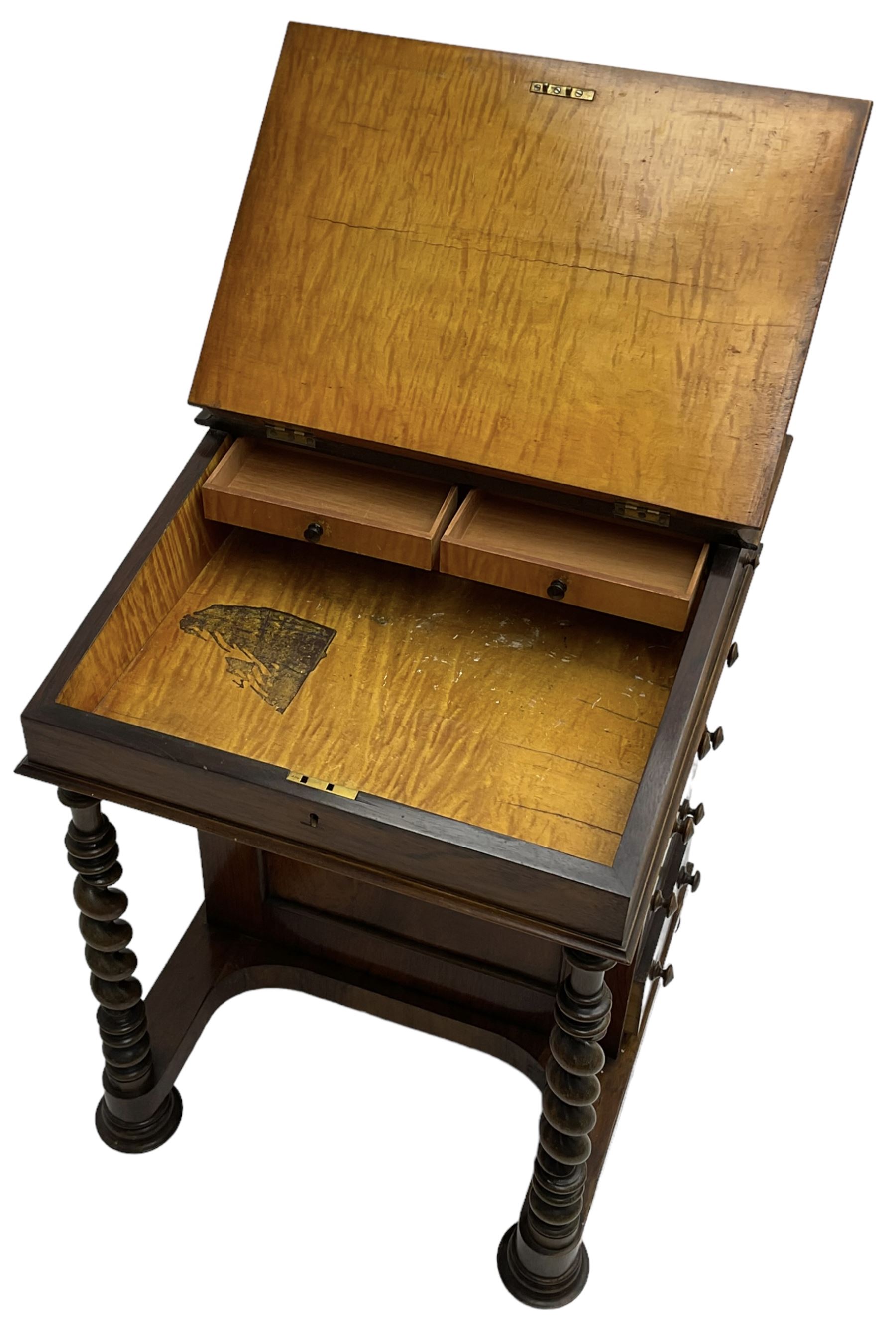 Victorian walnut Davenport, hinged sloping top with inset leather writing surface, enclosing satinwood lined interior with two drawers over faux drawer, fitted with inkwell drawer and pen compartment to the side over four drawers with an opposing false set, raised on spiral turned supports united by a shaped platform base