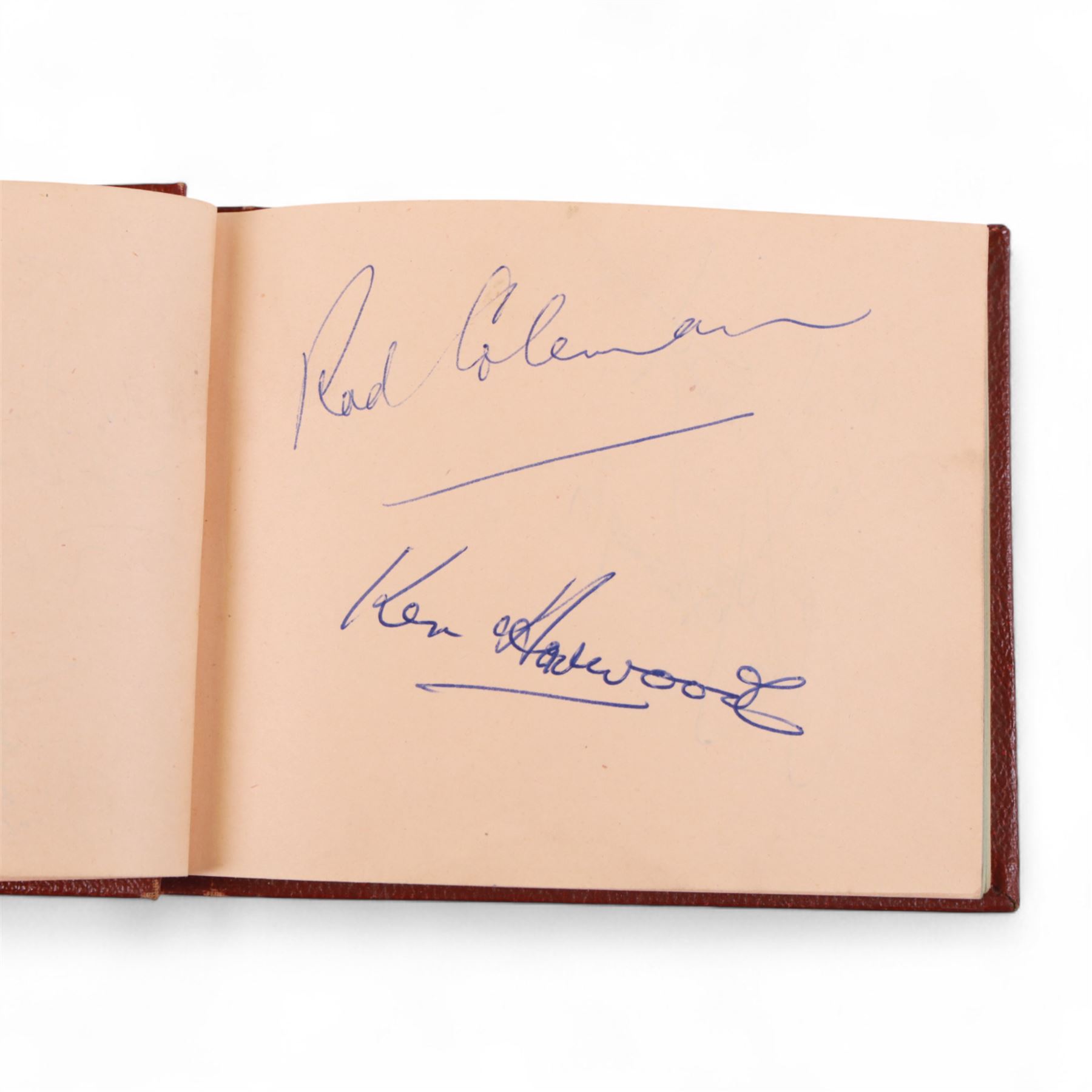 1950s autograph book, containing mostly motorcycle racing signatures, including four-time World Sidecar Champion Eric Oliver, 1952 Sidecar World Champion Cyril Smith and1955 Junior TT Champion Jack Bailey, in red leather case with gilt lettering 