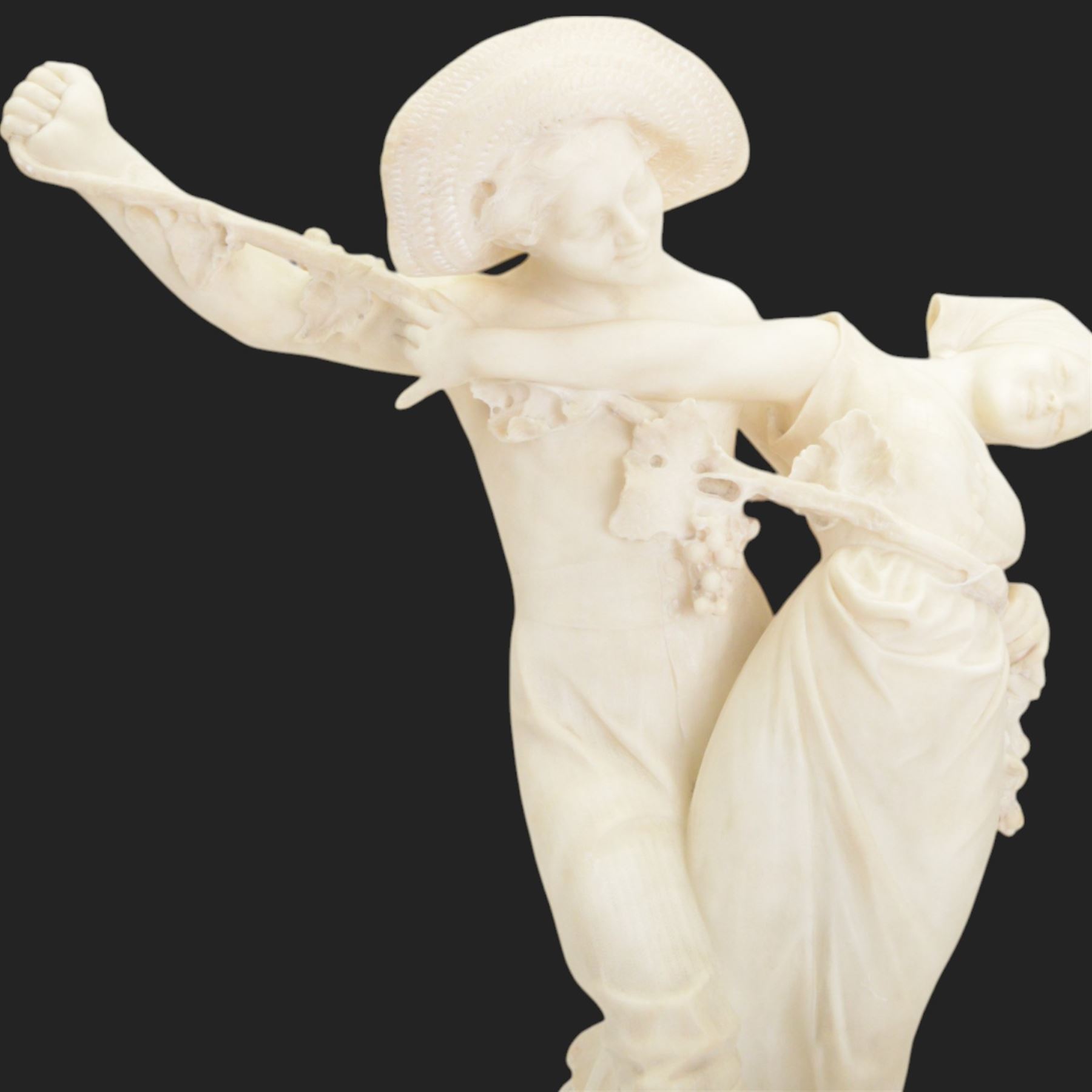 Alabaster bacchanalian figure group, modelled as two youths dancing entwined with a fruiting vine, the separate base signed D E Fiaschi, H58cm