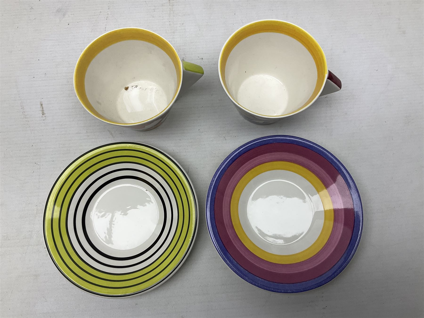 Wedgwood limited edition Clarice Cliff Design Taking Tea collection, comprising eight cups and saucers Honolulu, Apples, Gibraltar, Lilac Crocus, Trees and House, Coral Firs, Devon, and Sunray, with certificates of authenticity 