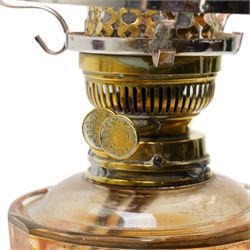 Victorian table oil lamp with cranberry glass shade, clear glass reservoir and brass column on circular base H58cm