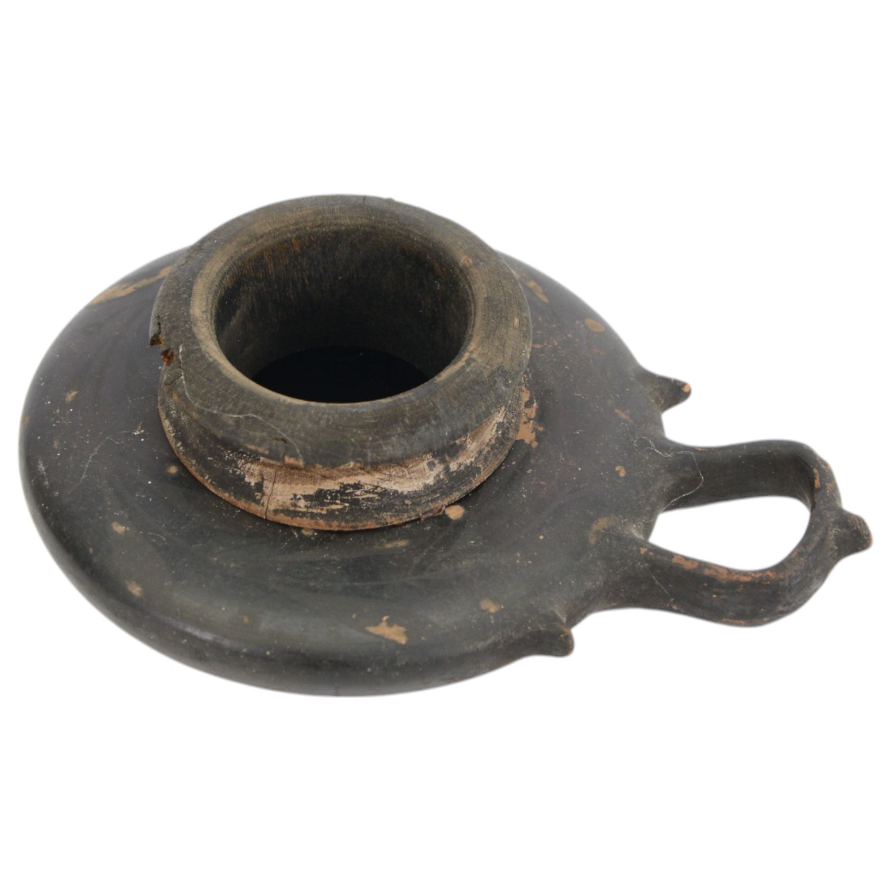 Etruscan terracotta oil lamp, with black glaze, flat loop handle and laurel leaf border, the opening with later turned wooden collar, signed to base 'repaired by one James Naysmith 1887', H7cm 