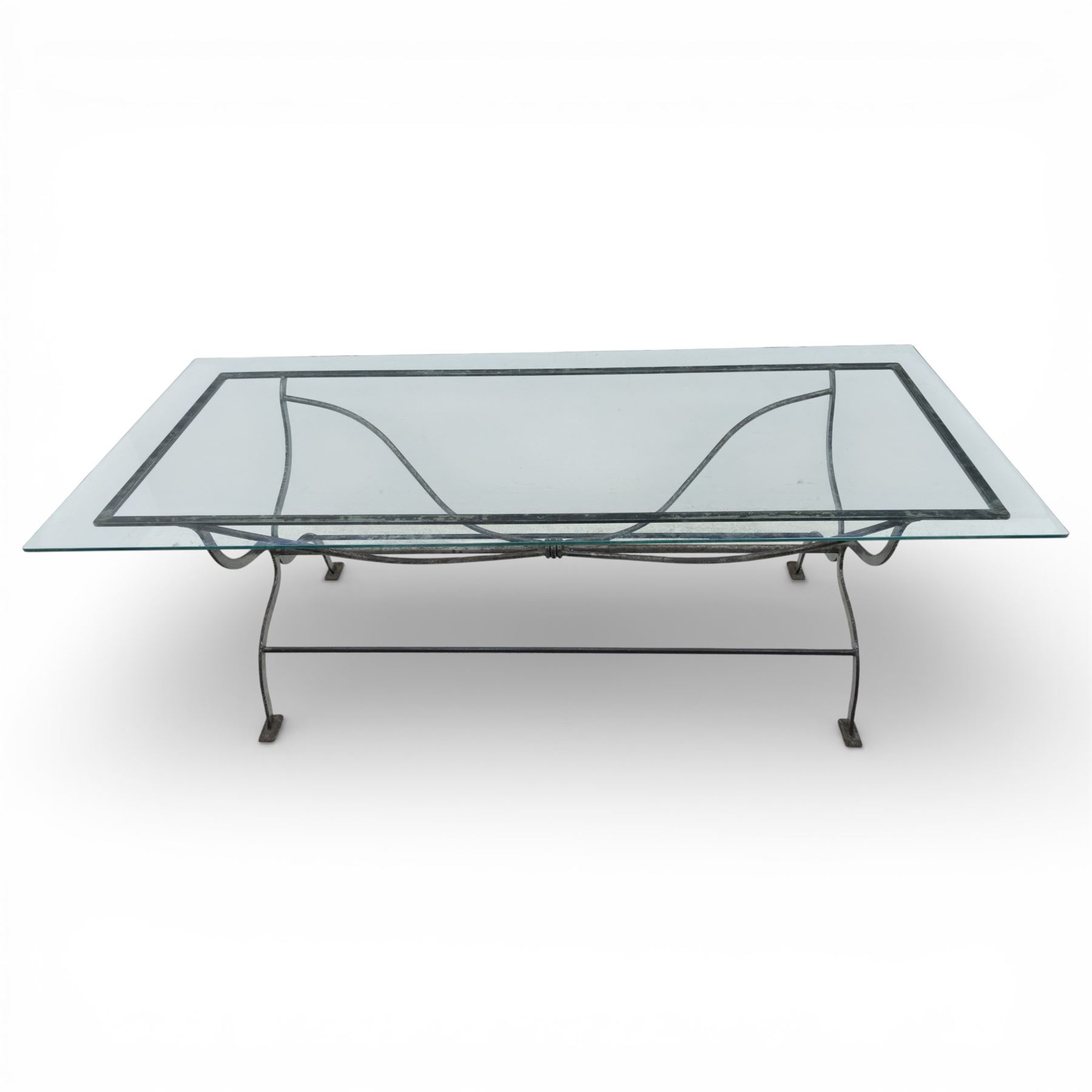Late 20th century glass dining table, toughened glass top with rounded corners on a wrought metal designed base 