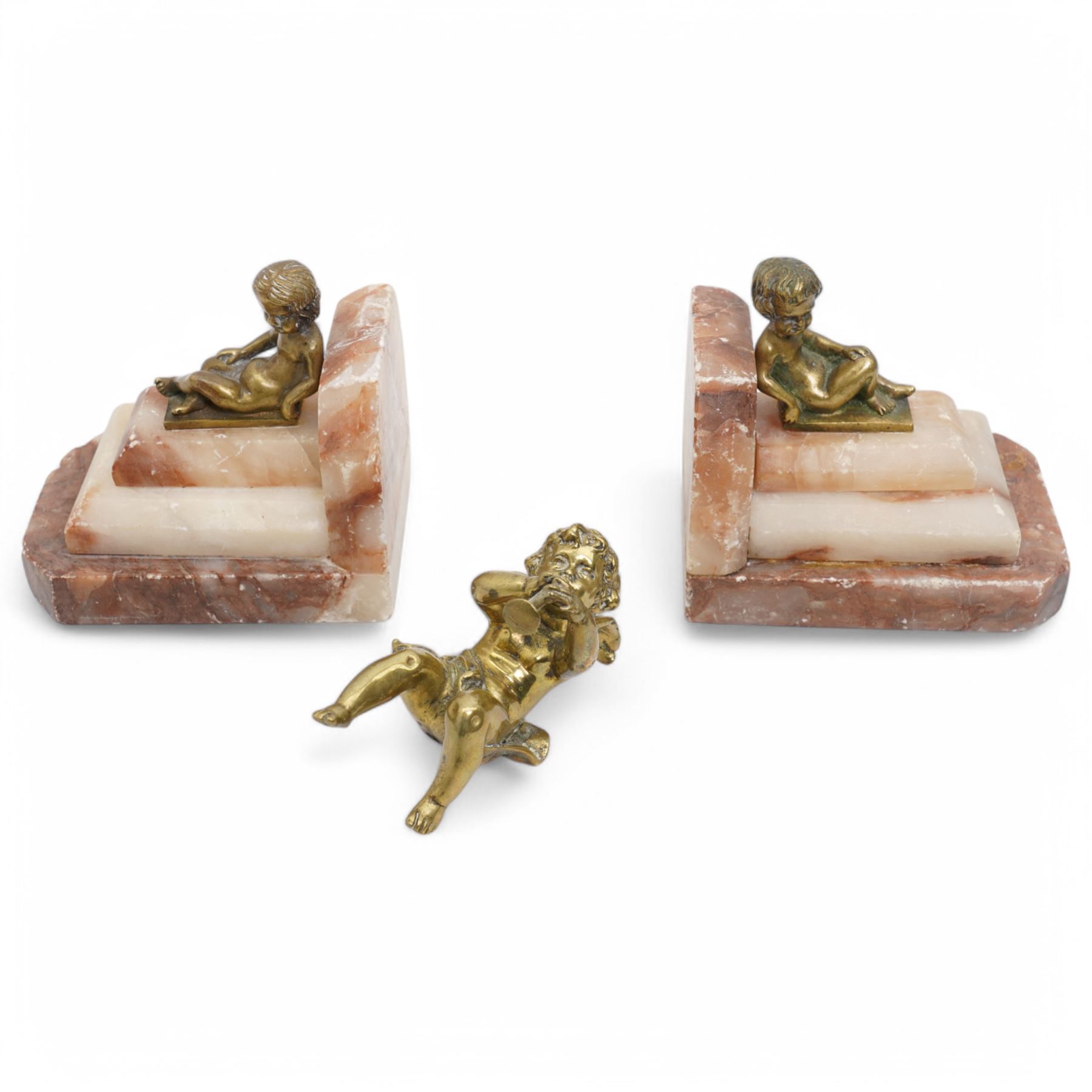 Brass and marble bookends with reclining putti figures, together with a brass figure of a cherub, bookends H8cm 
