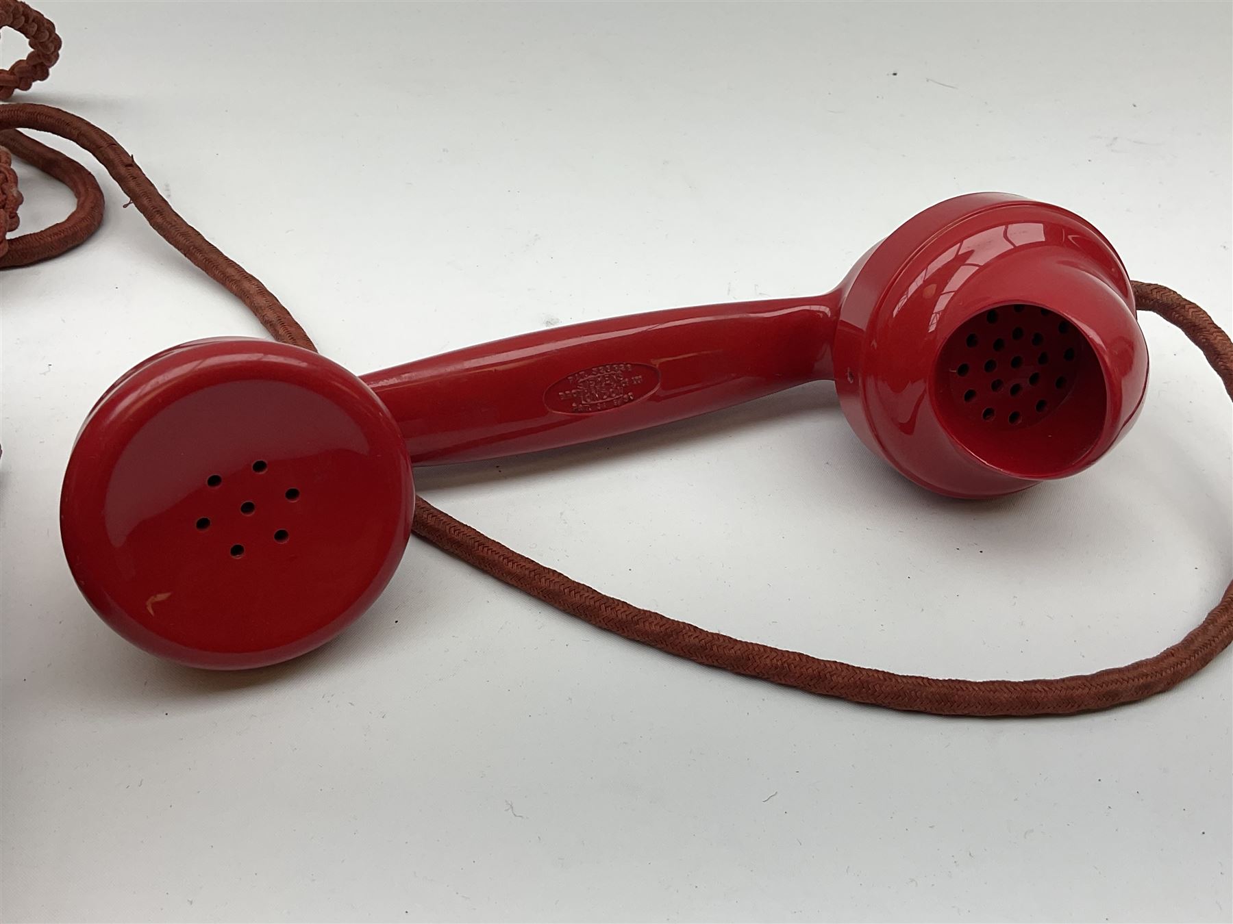 1950s Siemens Brothers red telephone with chrome rotary dial with enamel number plate and Siemens dial label, model 356, the body with base drawer below gilt logo, the handset with impressed mark PAT. 328926 PAT. SA 9/30, with red braided cord and red junction box (detatched), W15cm D18.5cm H14cm