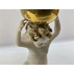 Pair of Capodimonte table lamps, in the form of cherubs holding a brass fitting, together with a pair of large Capodimonte figures in the form or a man and woman resting up on tree stump, largest example H57cm