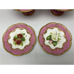 Victorian dessert service, comprising four comports and nine plates, each decorated with floral sprigs to the centre with a pink and gilt border, largest comport H13cm, plate D22.5cm