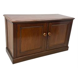 Victorian mahogany cupboard, plain rectangular top above two fielded panel doors opening to shelved interior, raised on a moulded plinth base, with later replacement knob handles
